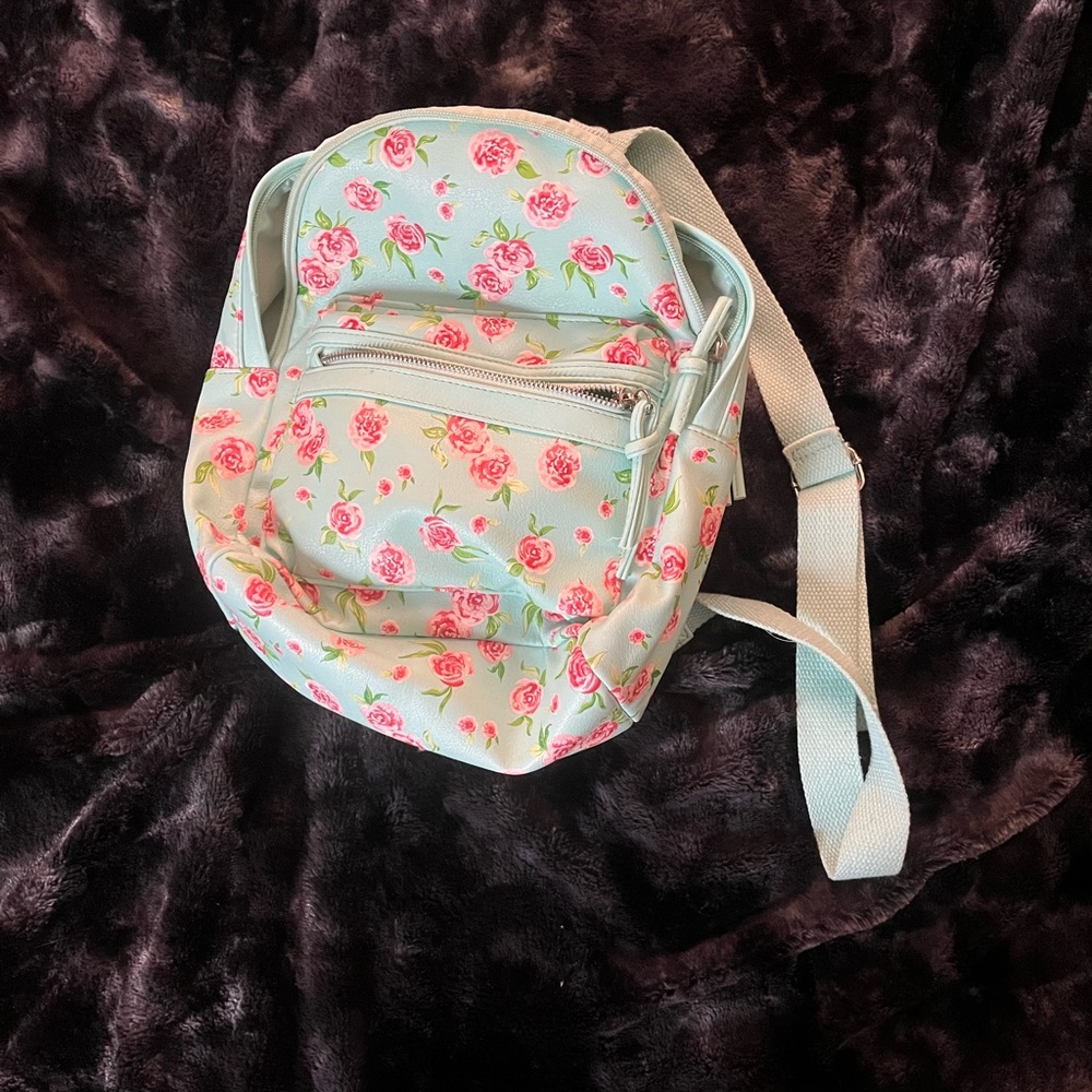 Teal, floral mini backpack with sparkly strap on holder for card.